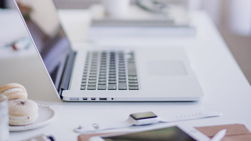 open laptop on white desk